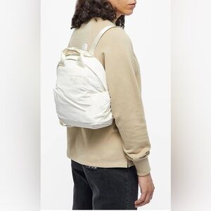 The North Face Mini Never Stop in ivory like new
